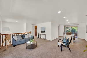 Living area featuring carpet and recessed lighting