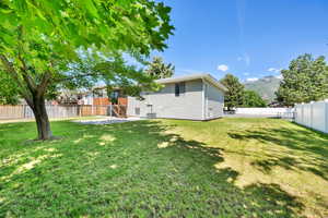 View of yard with a mountain view, a patio area, and central AC unit