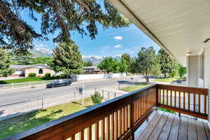 Wooden terrace featuring a mountain view