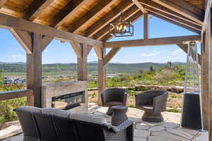 View of patio / terrace featuring a mountain view, an outdoor living space, and a gazebo