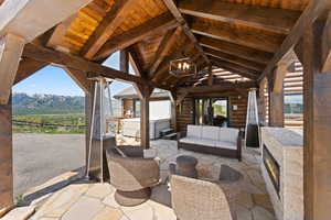 View of patio featuring a mountain view and an outdoor hangout area