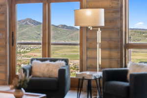 Sitting room with plenty of natural light and a mountain view
