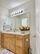 Bathroom featuring vanity and tile patterned floors