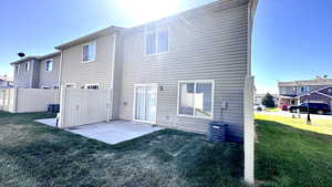 Rear view of property with a patio and central air condition unit