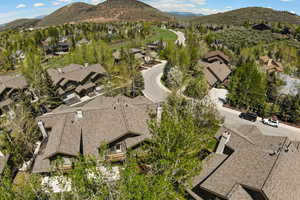 Aerial view of residential area featuring a mountain backdrop