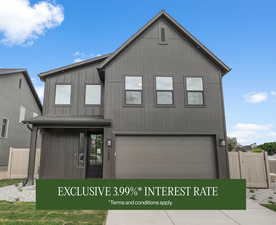 View of front facade with an attached garage and driveway