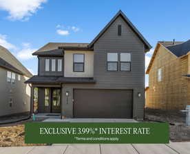 View of front of property featuring an attached garage