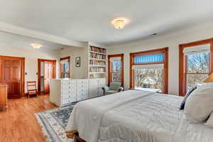 Bedroom with light wood-style floors