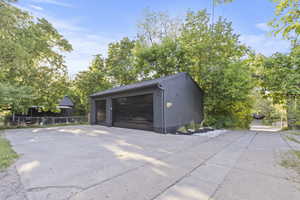 View of RARE 3-car detached garage with alley access.