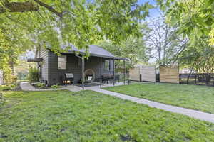View of yard featuring the covered patio and privacy panels.