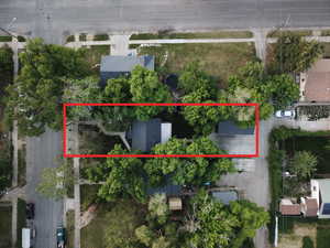 View of property location with property parcel outlined and additional alley access to the back.