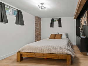 Bedroom featuring light wood finished floors and baseboards