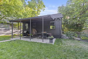 Rear view of house with a patio area