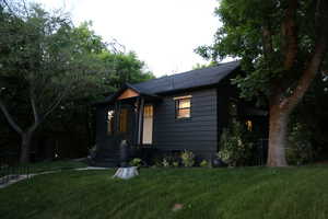 View of front of home featuring the front yard landscping.