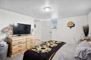 Bedroom with a textured ceiling