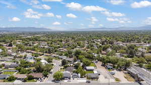 Aerial perspective of suburban area with a mountain backdrop