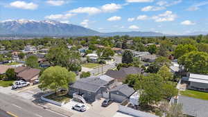 Aerial perspective of suburban area featuring a mountainous background