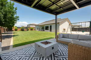 View of patio / terrace with an outdoor living space with a fire pit and a playground