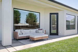 View of patio featuring an outdoor hangout area