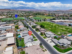 Aerial perspective of suburban area featuring a mountainous background