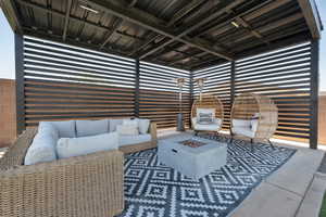 View of patio / terrace featuring an outdoor living space with a fire pit