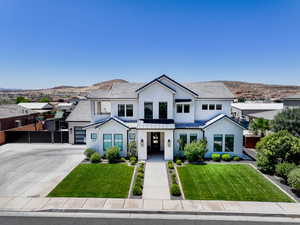 Modern farmhouse with concrete driveway, stucco siding, a tile roof, and a garage