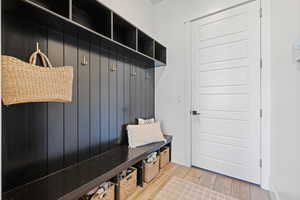 Mudroom featuring wood finished floors