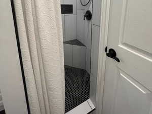 Full bath with tiled shower