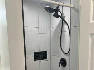 Bathroom with tiled shower