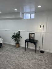 Below grade area with carpet floors and recessed lighting