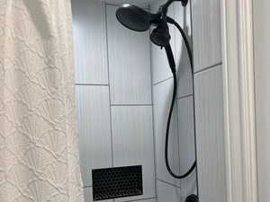 Full bathroom with curtained shower