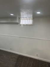 Unfurnished room with recessed lighting and carpet floors