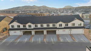 Aerial perspective of suburban area with a mountain backdrop