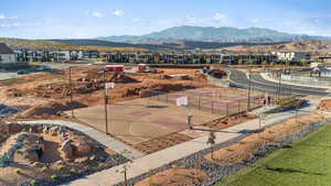 View of mountain background featuring nearby suburban area