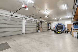Garage featuring a garage door opener