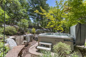 View of yard with a hot tub