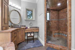 Bathroom with a shower stall, vanity, recessed lighting, and baseboards
