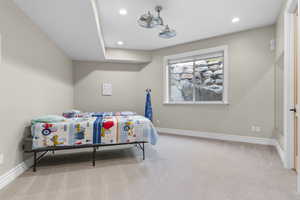 Bedroom with carpet floors, baseboards, and recessed lighting