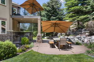 View of patio / terrace with a balcony, area for grilling, and outdoor dining area