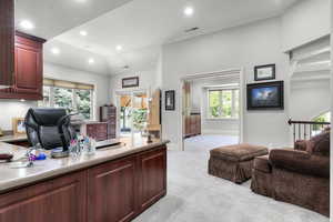 Office space with light carpet, recessed lighting, and baseboards