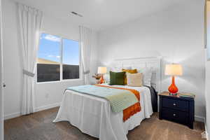Carpeted bedroom featuring baseboards