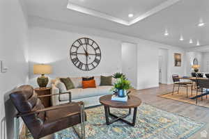 Living area featuring wood finished floors, recessed lighting, and baseboards