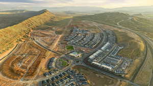 Aerial view of property and surrounding area featuring mountains