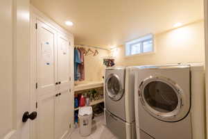 Laundry Room that goes with cabinets that open to primary suite