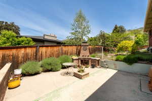Backyard patio with woodburning stove