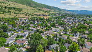 View of property location featuring a mountainous background and nearby suburban area