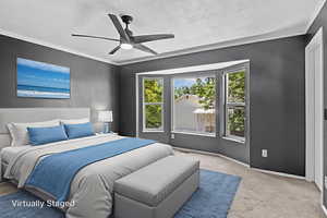 virtually staged Bedroom with carpet floors, a textured ceiling, baseboards, and ceiling fan