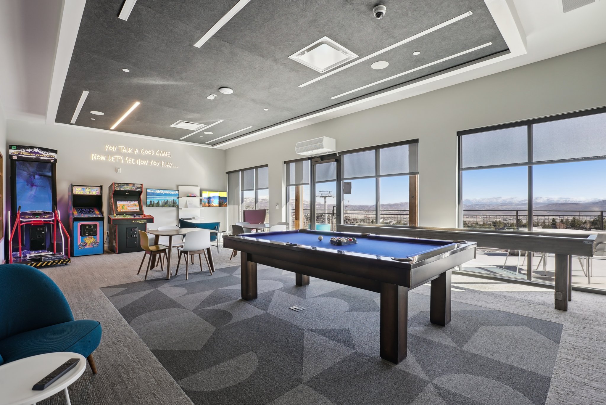 Recreation room featuring carpet flooring, plenty of natural light, and billiards table