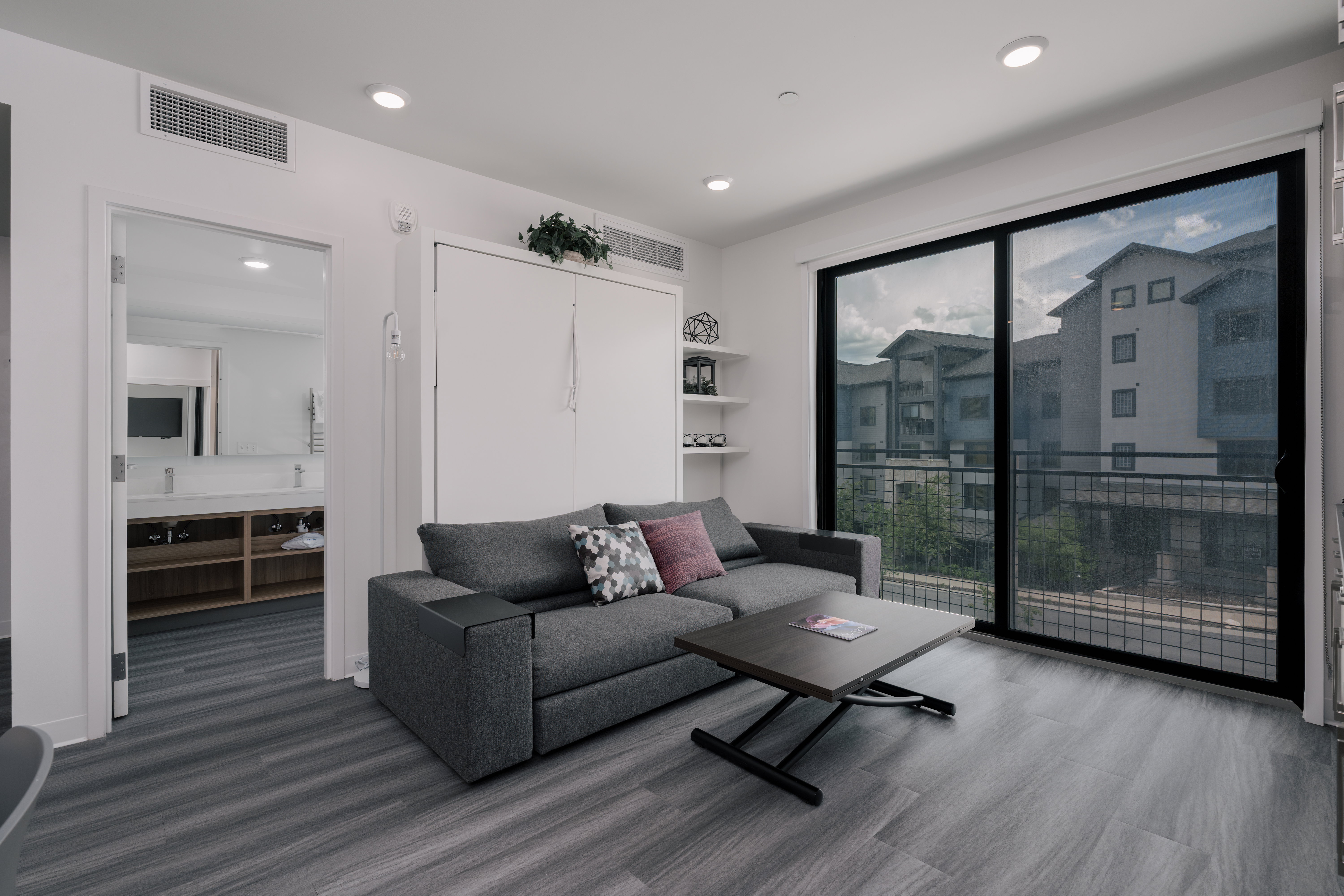 Living room featuring wood finished floors and recessed lighting
