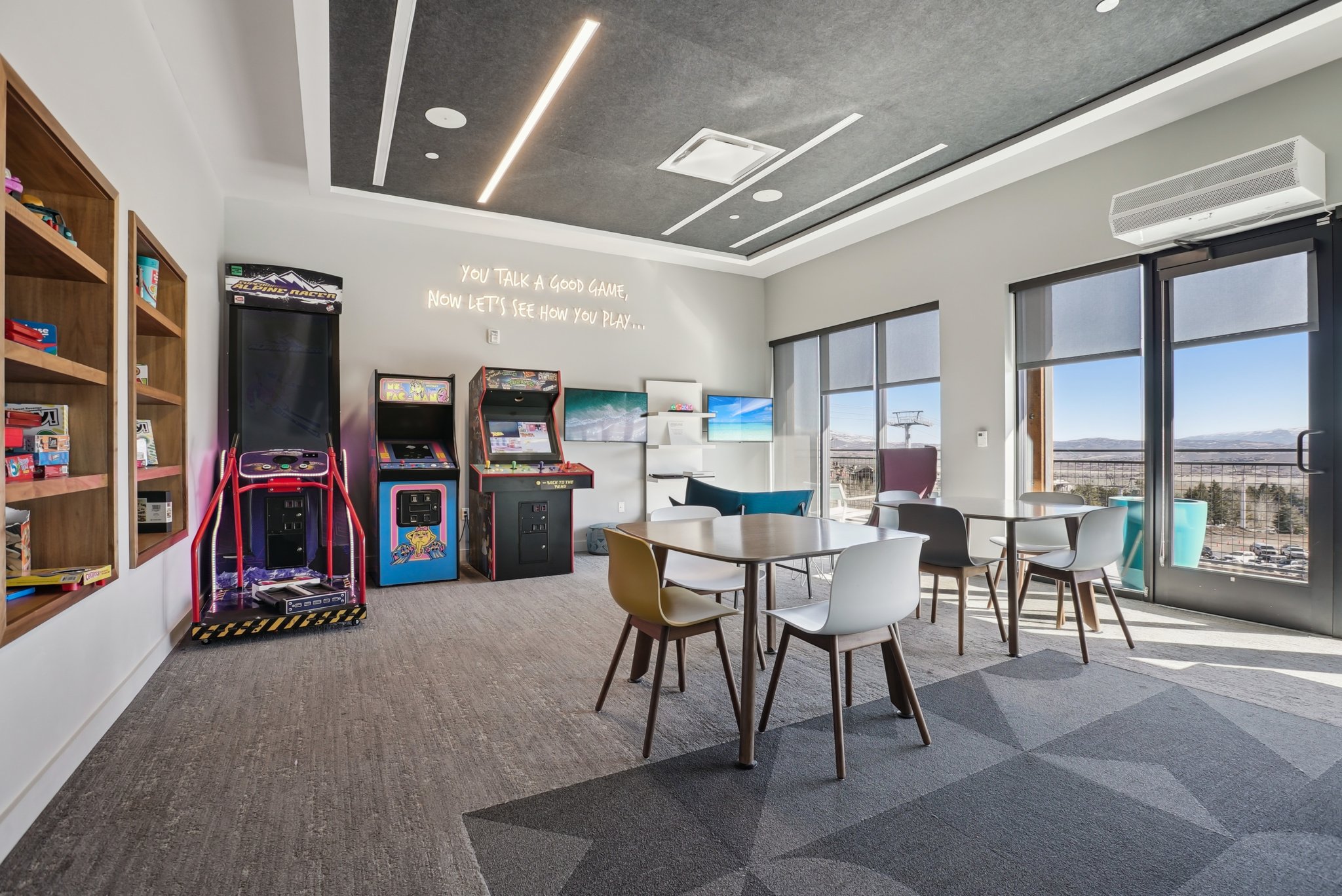 Dining area featuring a wall mounted air conditioner and wood finished floors